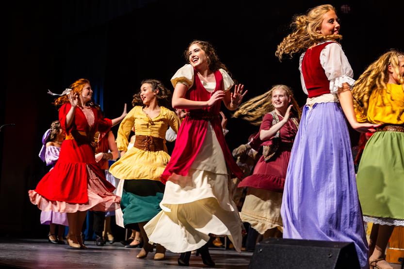 Actors perform onstage